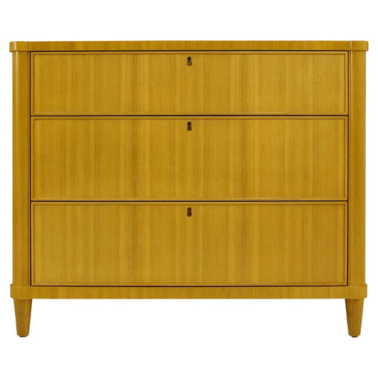 Wooden dresser with three drawers on a white background