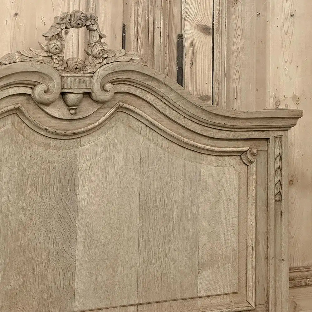 Wooden panel with intricate carvings and a decorative crest.
