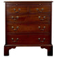Wooden dresser with four drawers on a white background