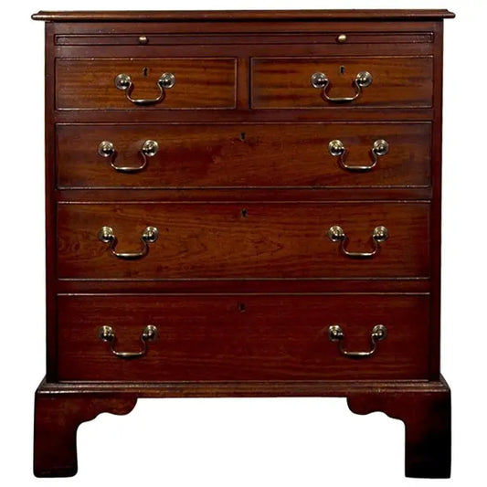 Wooden dresser with four drawers on a white background