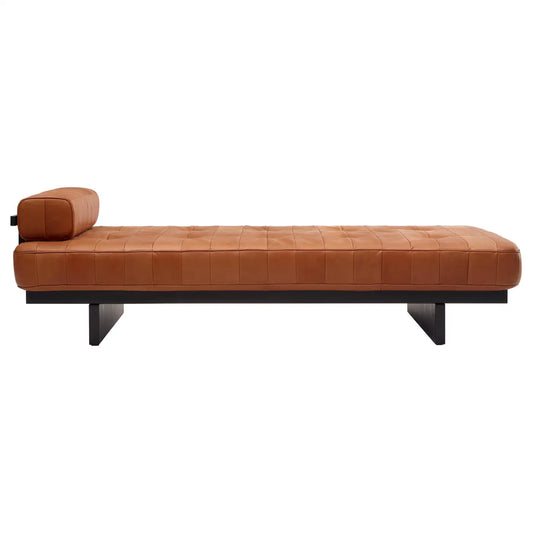 Brown leather daybed on a white background