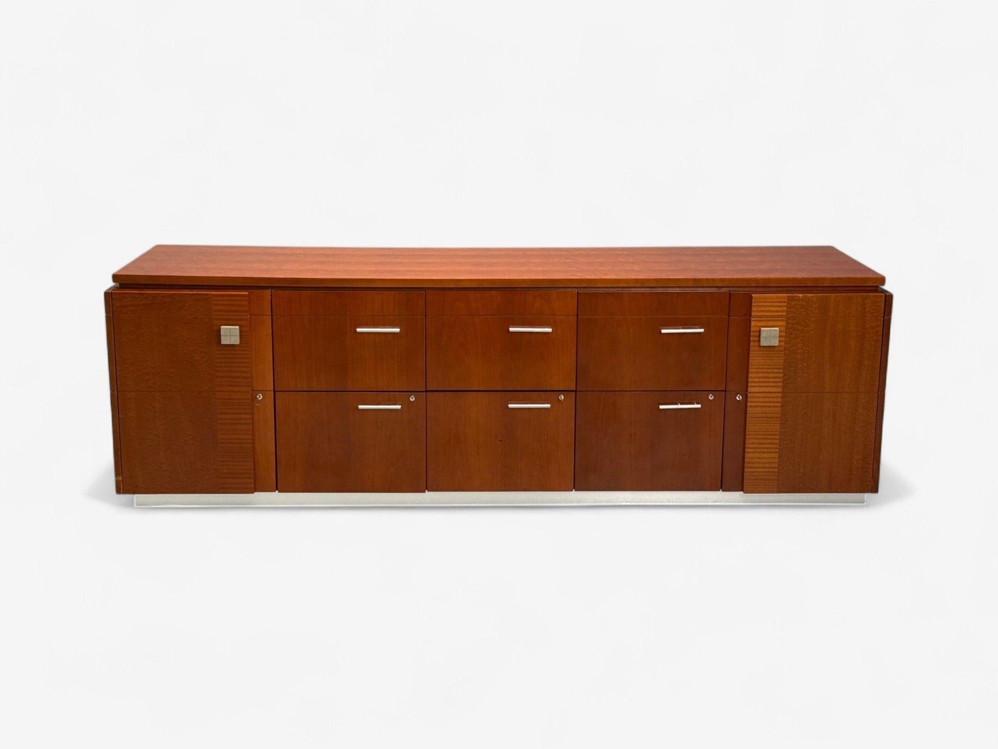 Wooden sideboard with multiple drawers on a white background