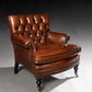 Brown leather armchair on a gray background