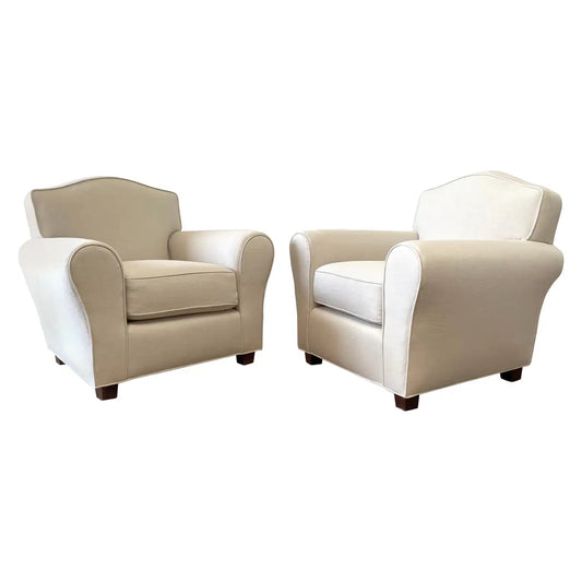 Two beige and white armchairs on a white background