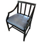 Black armchair with a gray cushion on a white background