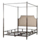 Canopy bed with metal frame and upholstered headboard on a white background
