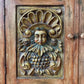Rustic Spanish Colonial Hacienda Cabinet – Hand-Carved Faces & Floral Motifs