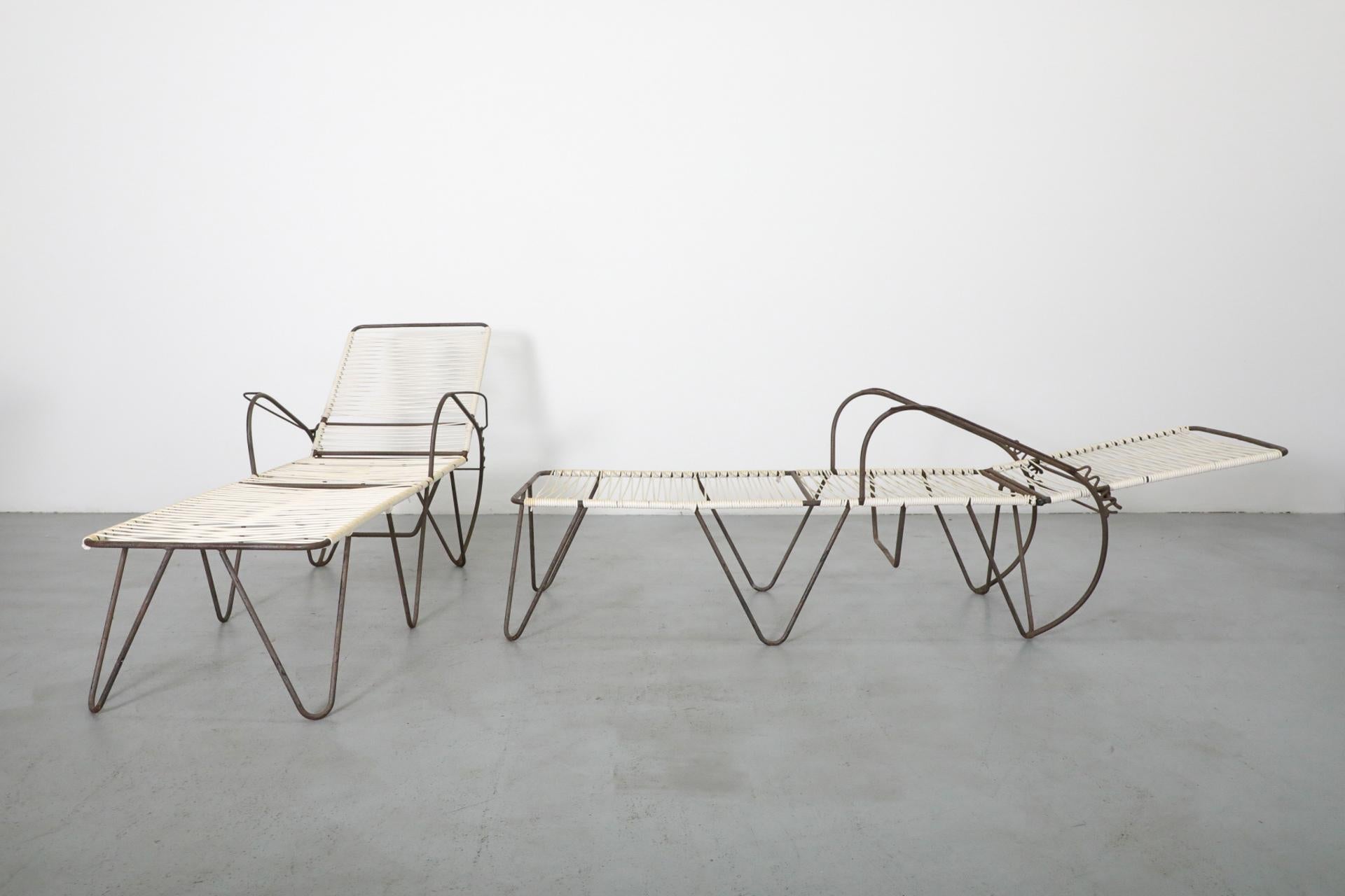 Modern lounge chair and table set on a gray floor with white background
