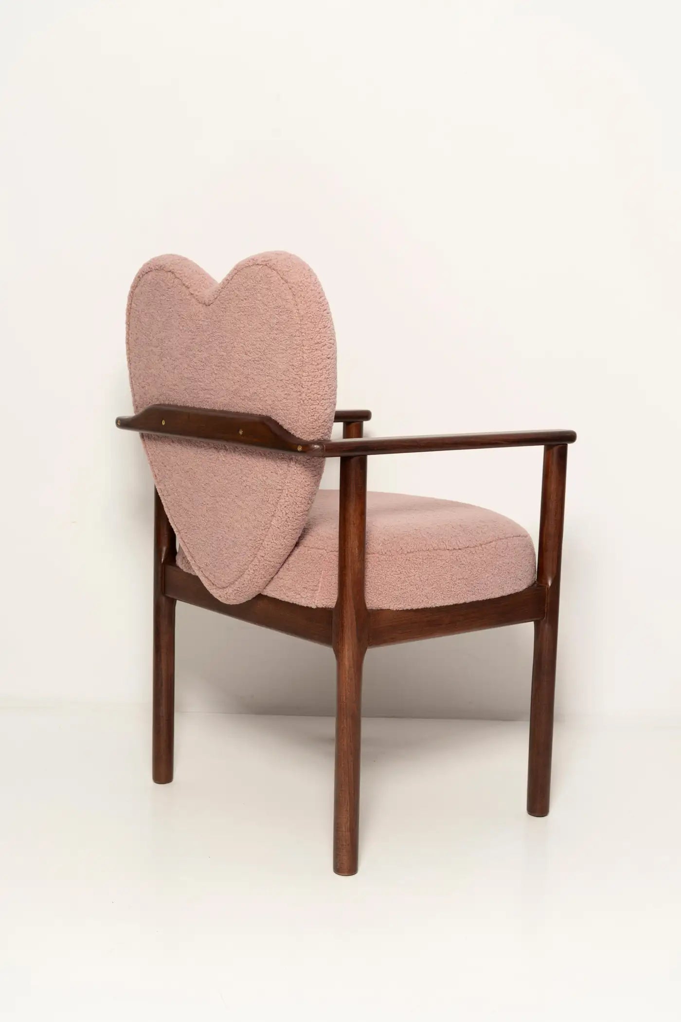 Chair with pink heart-shaped backrest on a white background