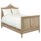 Wooden bed with intricate carvings on a white background