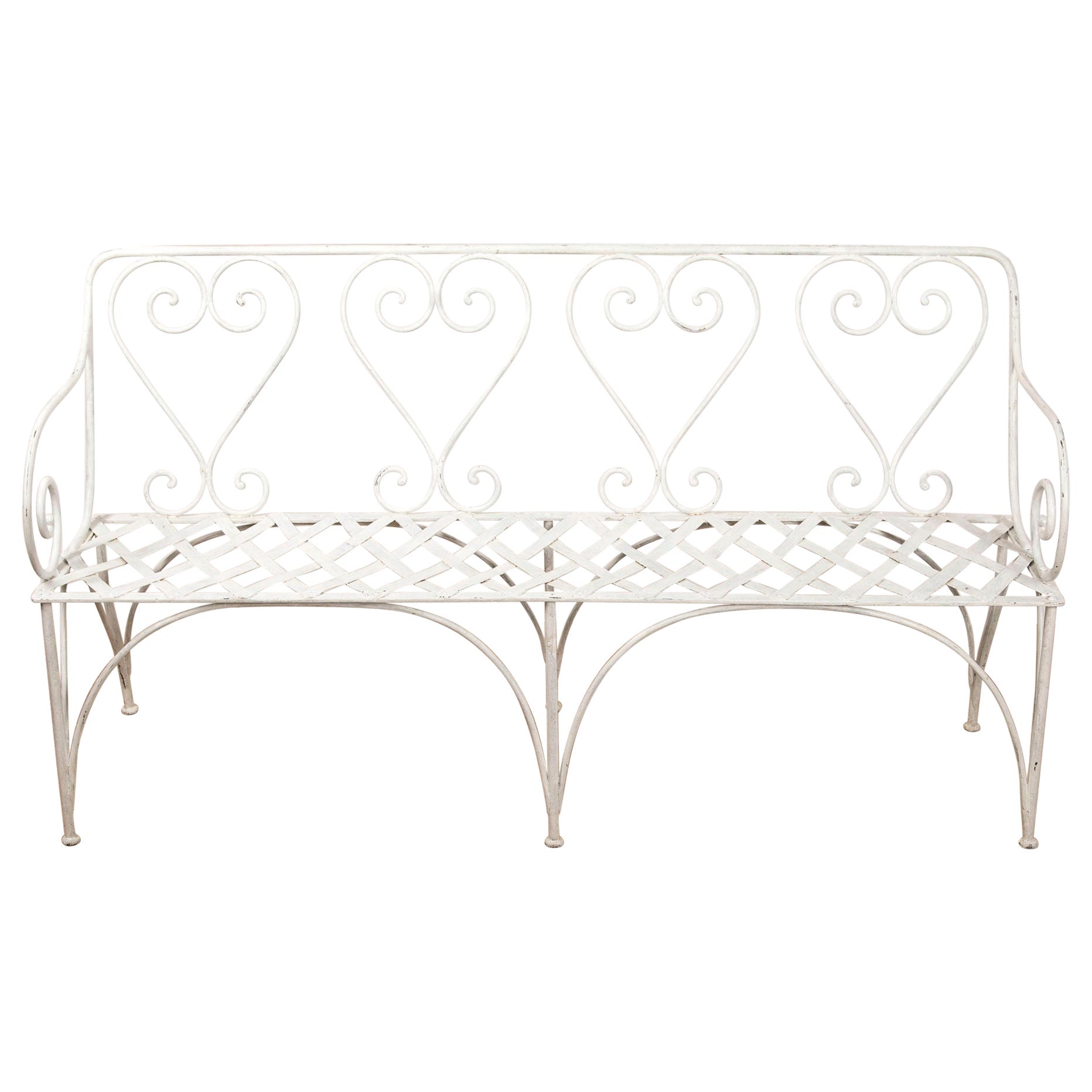 White metal bench with heart-shaped backrest on a white background