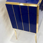 Blue cabinet with gold accents on a white background