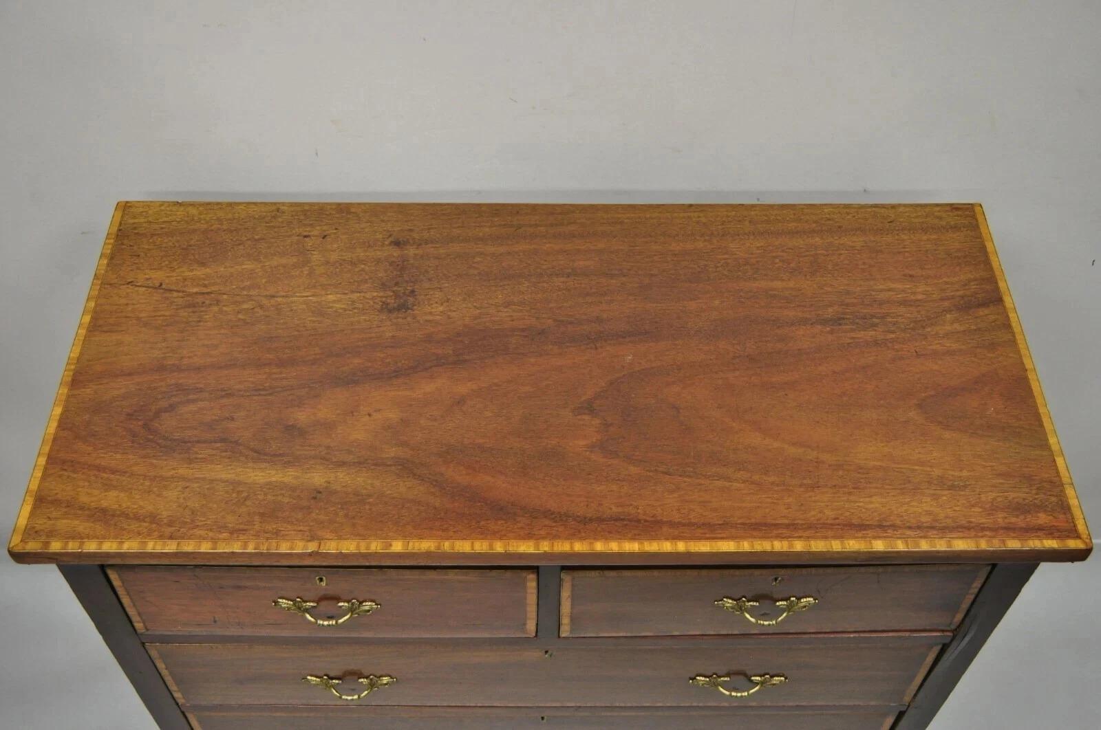 Wooden dresser with four drawers on a plain background