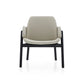 Modern chair with beige cushion and black frame on a white background