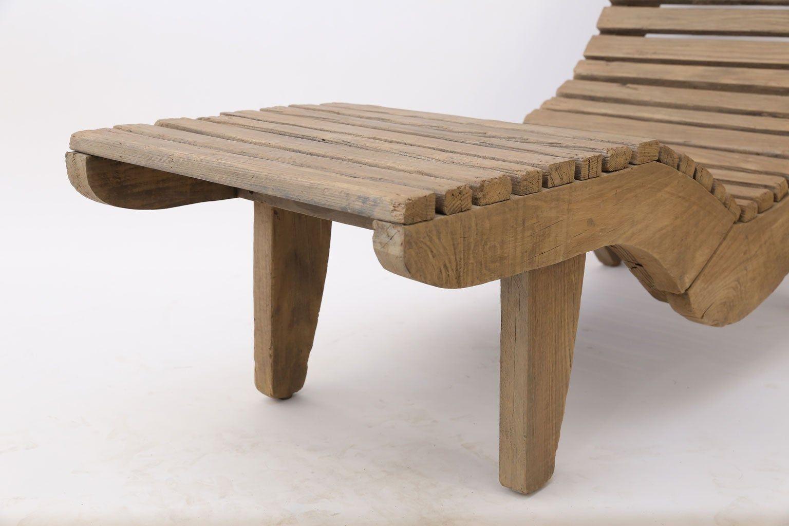 Wooden outdoor lounge chair on a white background