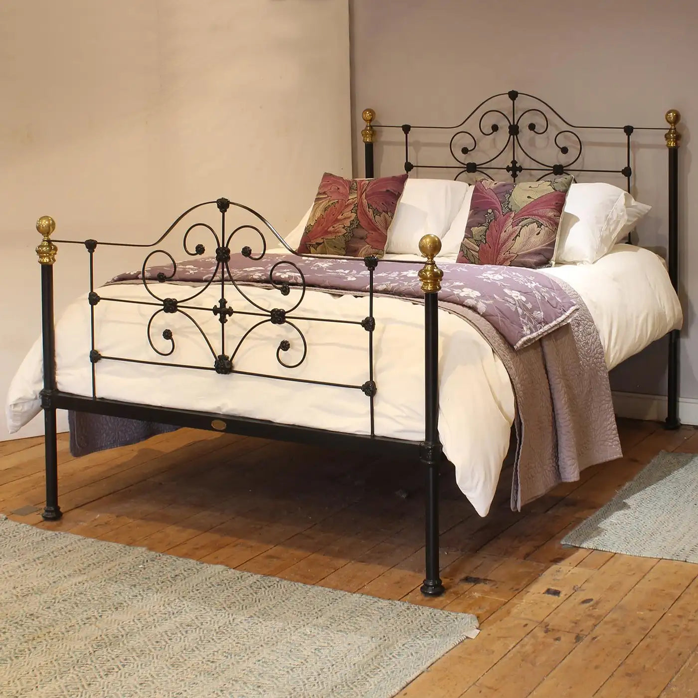 Decorative metal bed with bedding in a bedroom setting