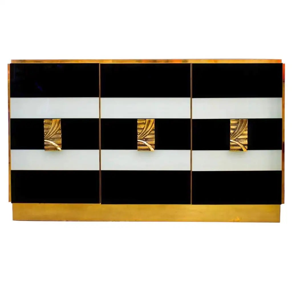 Decorative cabinet with black, white, and gold design on a white background