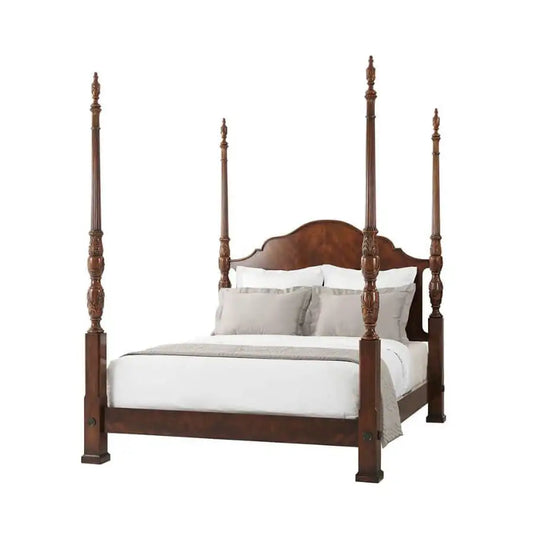 Wooden four-poster bed with white bedding on a white background