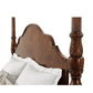 Wooden headboard with intricate carvings on a white background