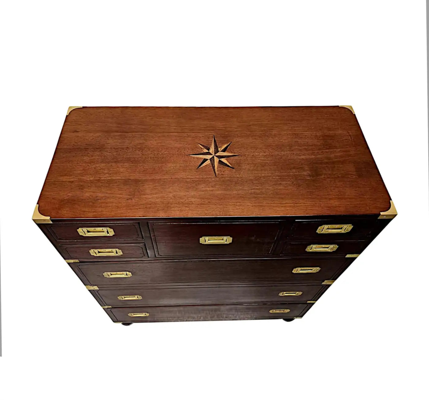 Wooden chest with brass handles and star design on a white background