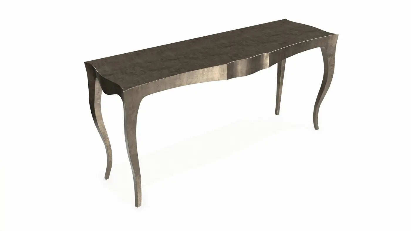 Decorative console table with a metallic finish on a white background
