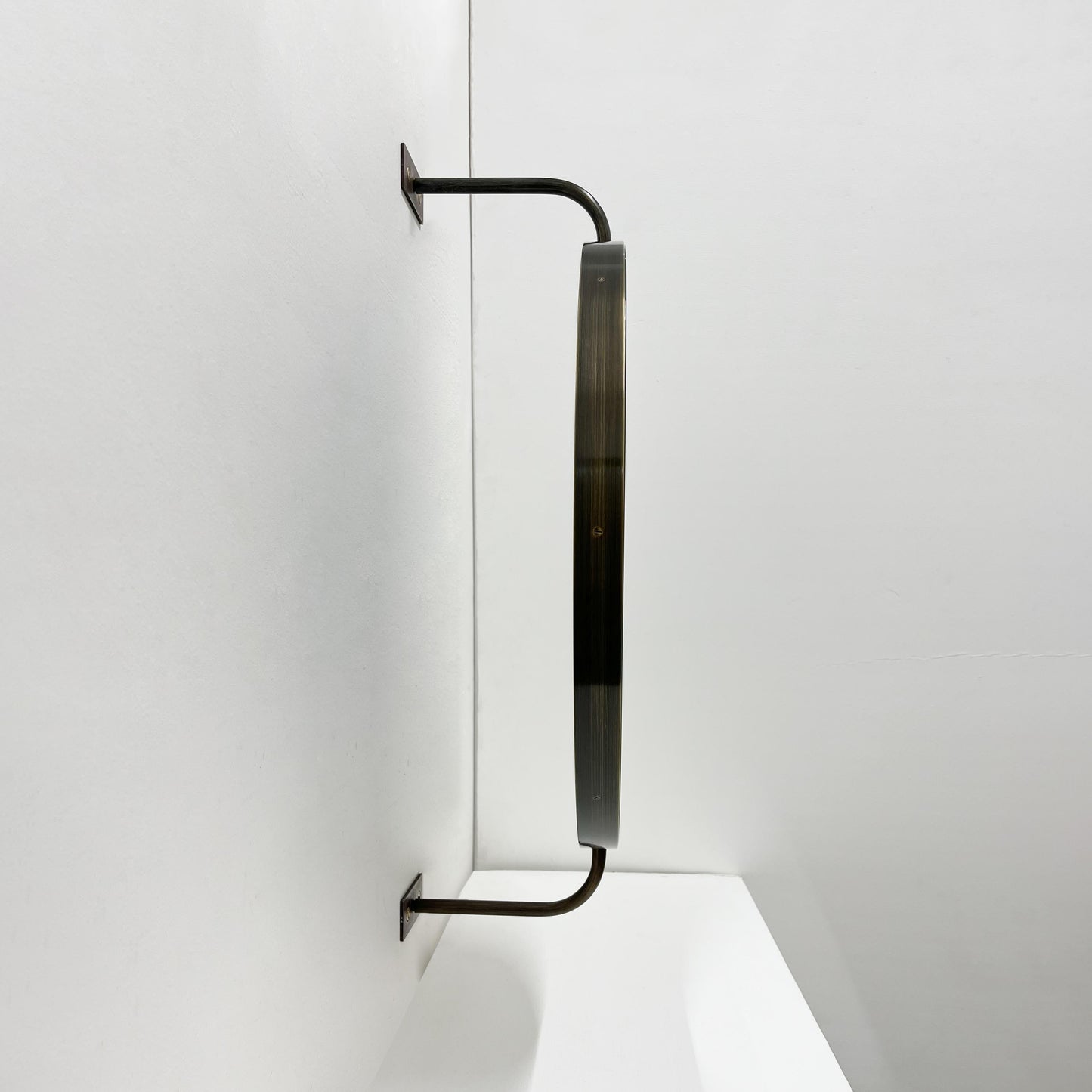 Vorso Wall-Attached Rotating Round Mirror with Bronze Patina Frame – Contemporary