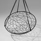 Decorative hanging chair with stained glass design on a gray background