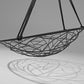 Black wire hammock chair on a gray background