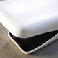 White and black object on a concrete surface