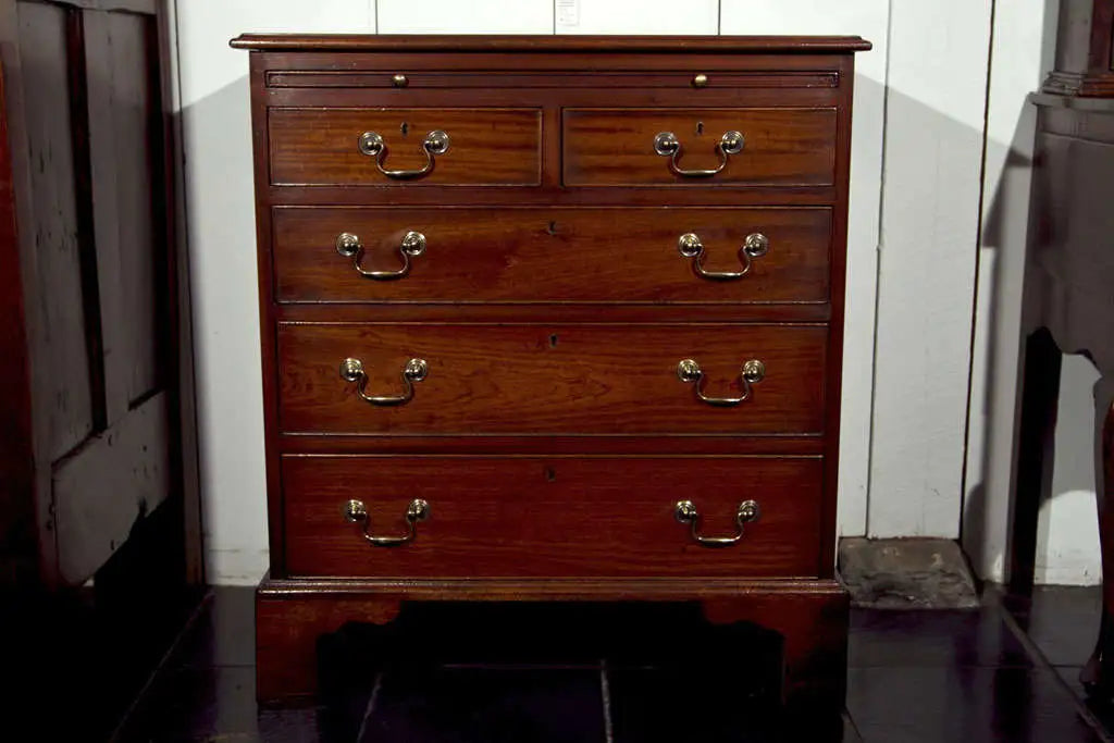 Wooden dresser with multiple drawers in a room setting