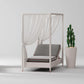 Modern outdoor chair with canopy and cushion next to a potted cactus on a light background