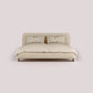 Beige sofa with a textured surface on a light pink background