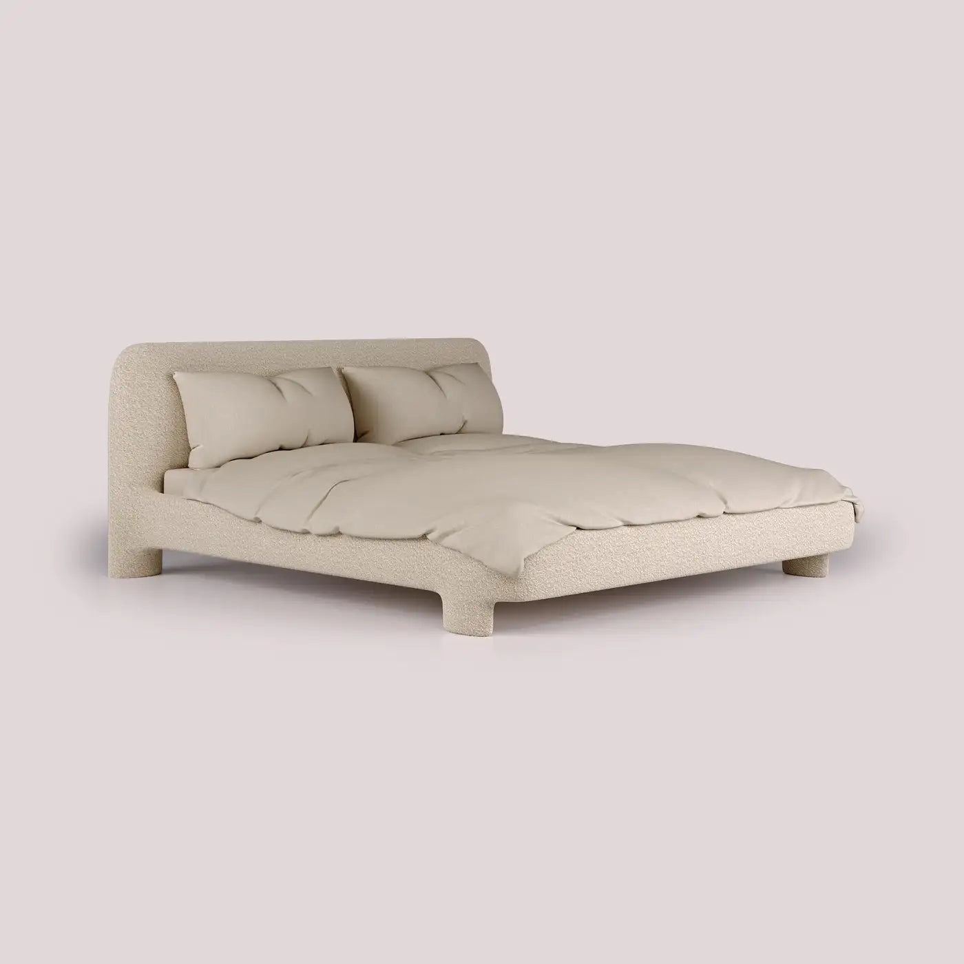 Beige bed with pillows on a light beige background