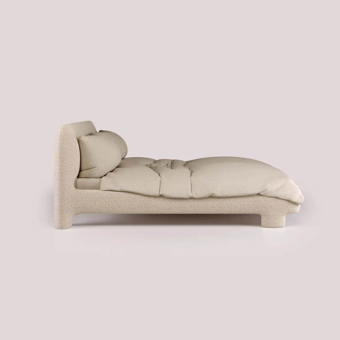 Beige sofa with a pillow on a light gray background