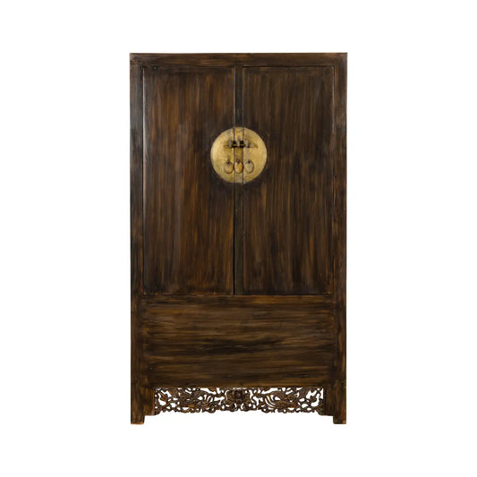 Wooden wardrobe with intricate carvings on a white background