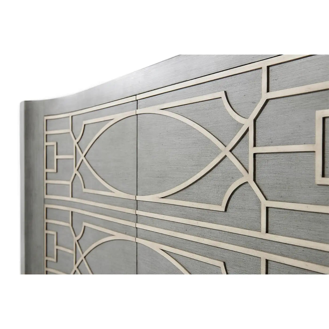 Metallic surface with geometric cut-out design on a white background