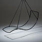 Black wire chair with curved design on a gray background
