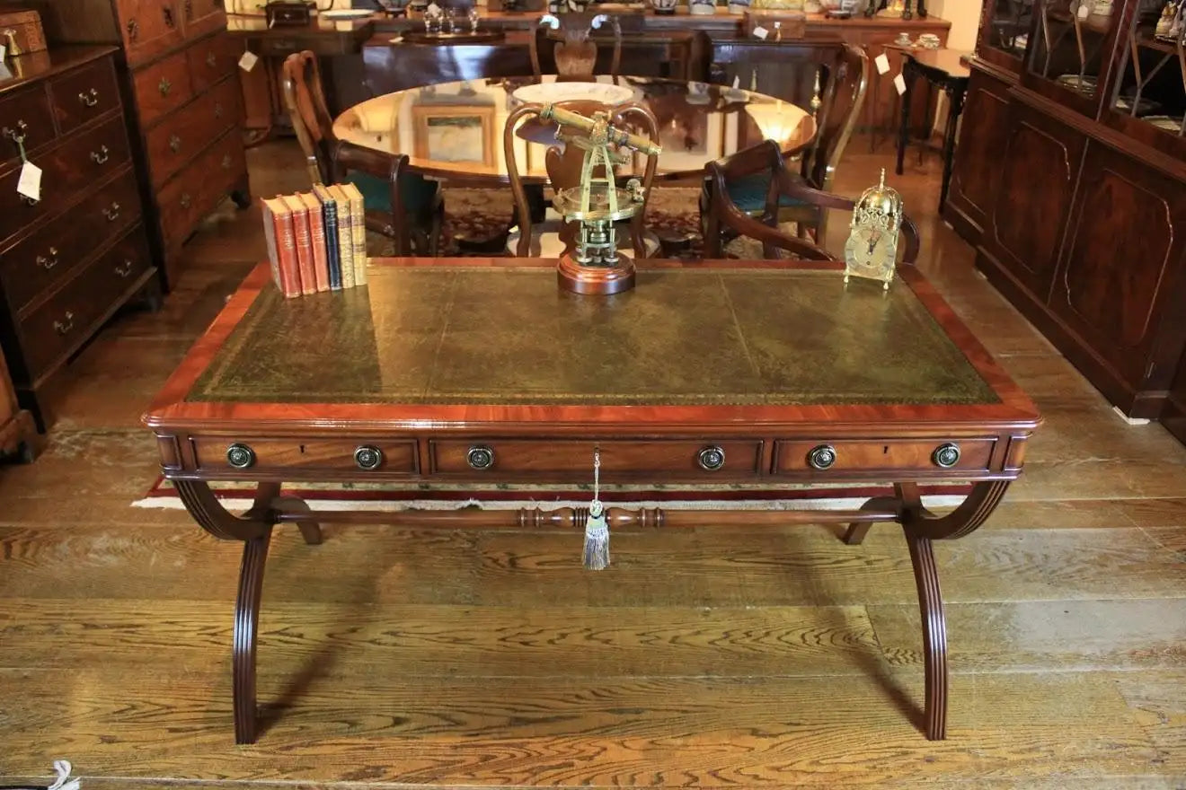 Wooden desk with leather surface in a room with wooden furniture