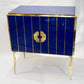 Decorative cabinet with blue lacquer and gold accents on a white background
