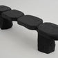 Black stone-like bench on a white background