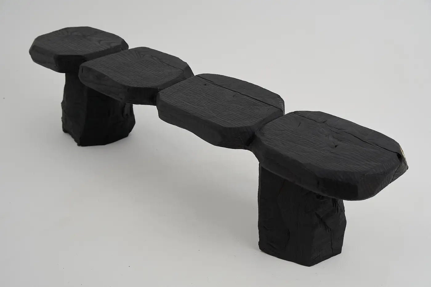 Black stone-like bench on a white background