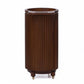 Wooden cylindrical trash can with pleated design on a white background