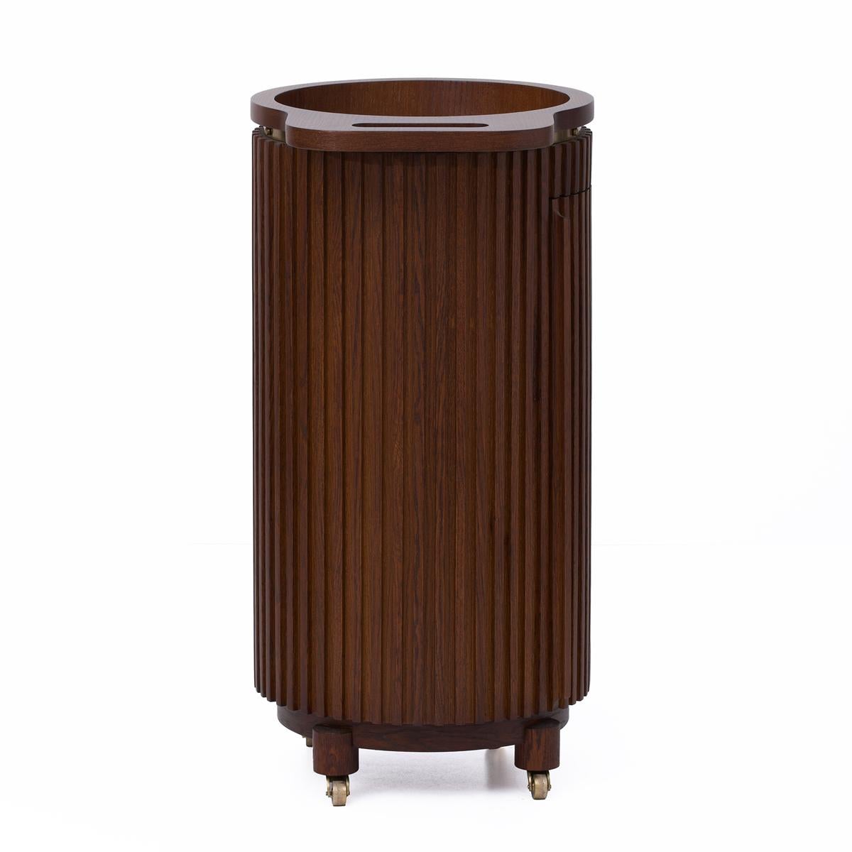 Wooden cylindrical trash can with pleated design on a white background
