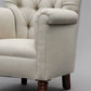 Beige armchair with wooden legs on a gray background