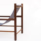 Wooden chair with a blue patterned seat on a white background