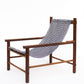 Wooden chair with a blue and white patterned fabric on a white background