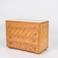 Wooden dresser with a checkered pattern on a white background
