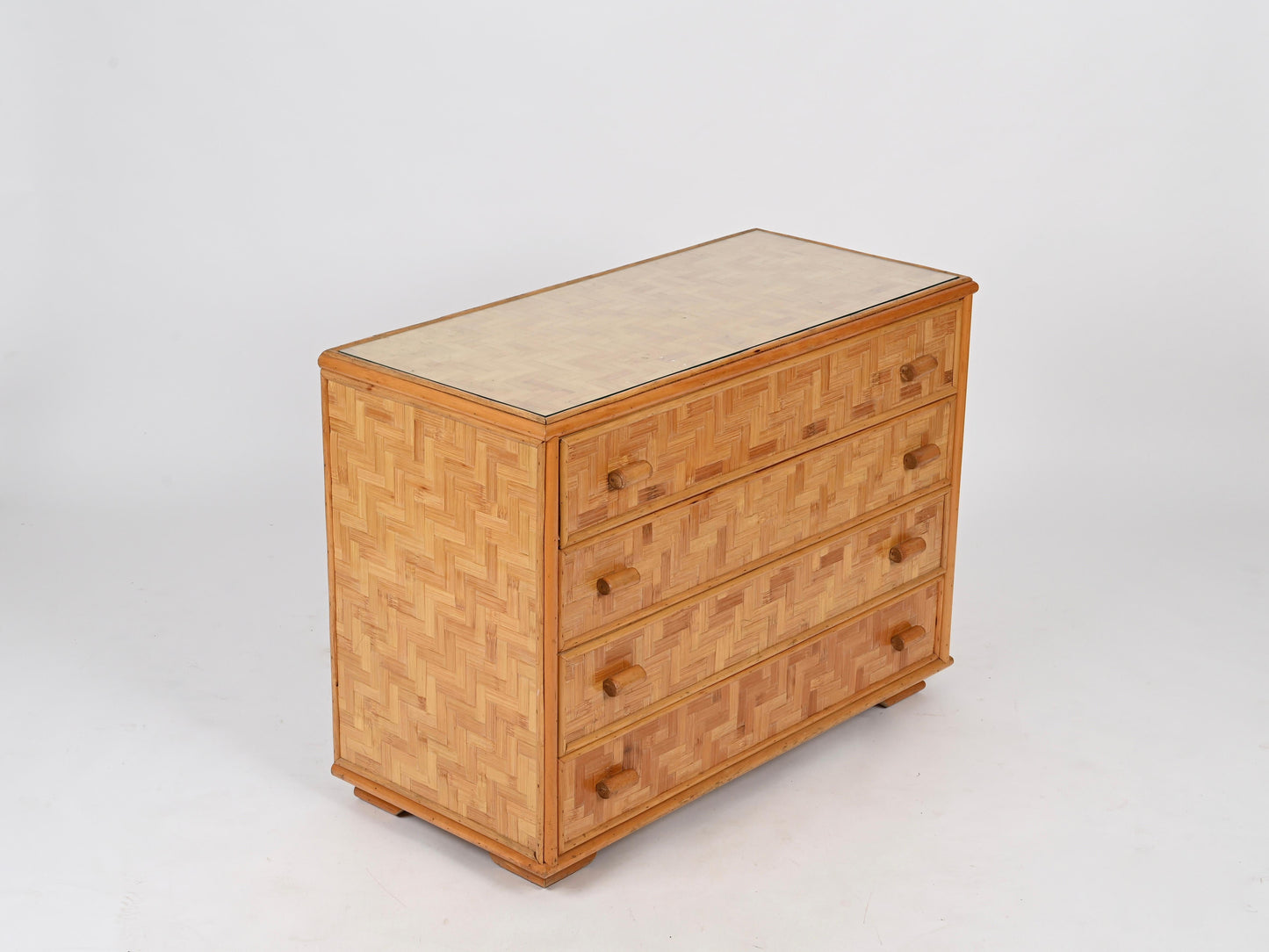 Wooden dresser with woven pattern on a white background