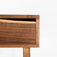 Close-up of a wooden drawer with a white background