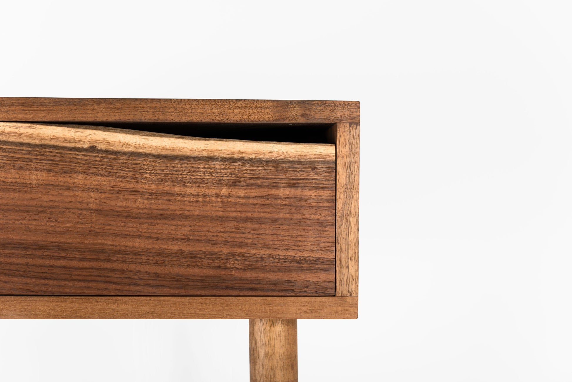 Close-up of a wooden drawer with a white background